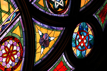 Close up of a stained glass window. Links to What to Give