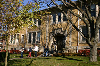 Students walking out of a building. Link to Life Stage Gift Planner Under Age 60 Situations.
